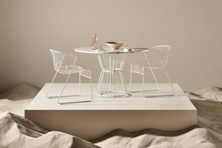 ND chairs and table set against a neutral background