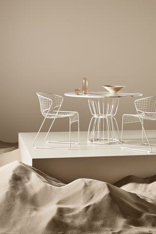 ND styled chairs and a table on a neutral background