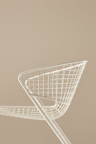 Side ND lounge chair on a beige background