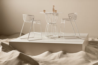 ND styled bar chairs and table set against a neutral background