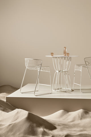 ND bar chairs and table on a neutral background