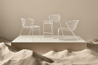 ND range of chairs on a platform with a desert landscape background