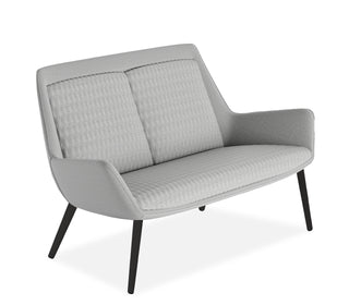 Gray sofa with quilted design on a white background