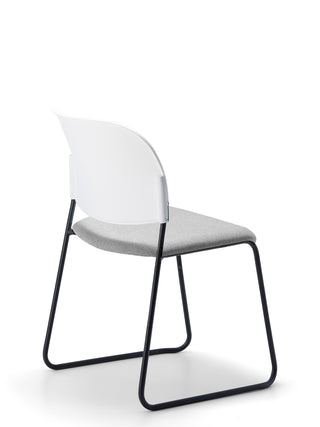 Advanta_Lumia-71 modern chair with a transparent backrest and black metal frame on a white background