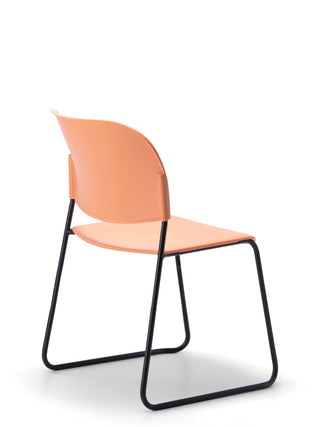 Advanta_Lumia-75 modern chair with a peach seat and backrest on a white background