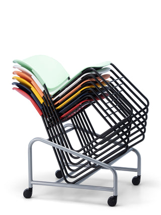 Stack of colorful chairs on a metal cart with wheels on a white background
