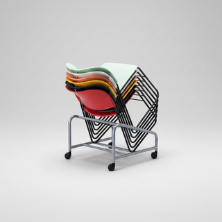 Stack of colorful plastic chairs on a metal stand against a white background