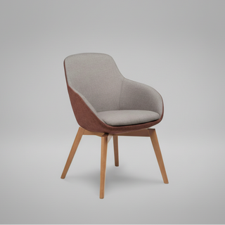 Chair with a gray cushion and wooden legs on a gray background