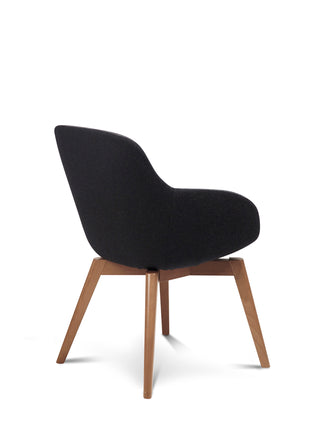 Black upholstered chair with wooden legs on a white background