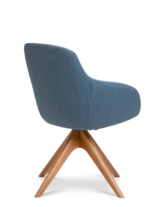 Blue upholstered chair with wooden legs on a white background