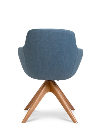 Blue upholstered chair with wooden legs on a white background