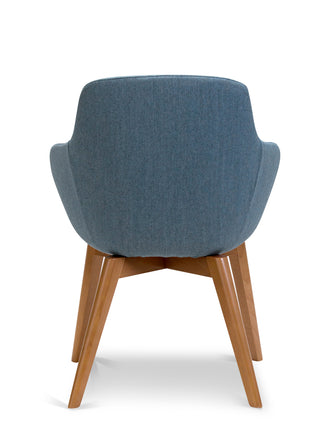 Blue upholstered chair with wooden legs on a white background