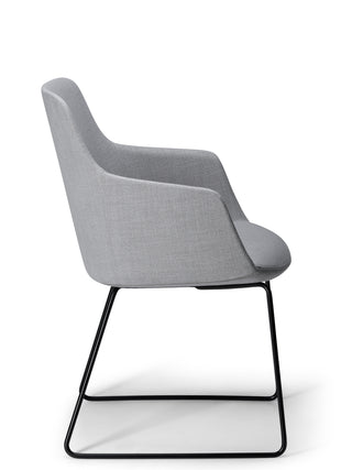Gray upholstered chair with black metal legs on a white background
