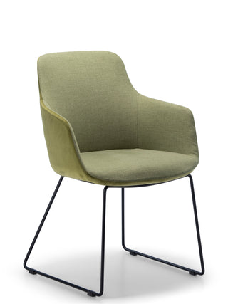 Green chair with black metal legs on a white background