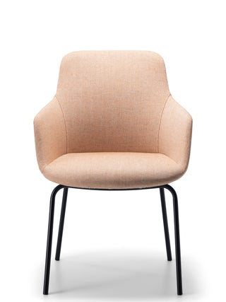 Peach armchair with black metal legs on a white background