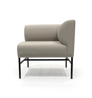 Modern gray armchair with black metal legs on a white background