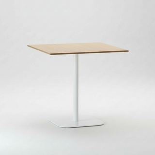 Square table with a light wood top and white metal legs on a white background