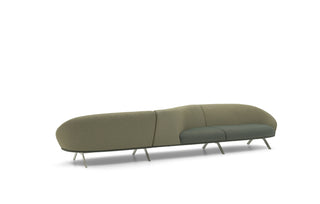 Modern green sofa with a unique design on a white background