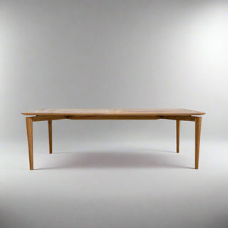 Wooden dining table on a grey background