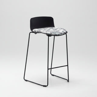 Bar stool with black frame and patterned seat on a white background