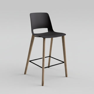 Black bar stool with wooden legs on a white background