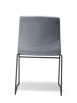 Odin Sled fabric back upholstered chair with black metal frame on a white background