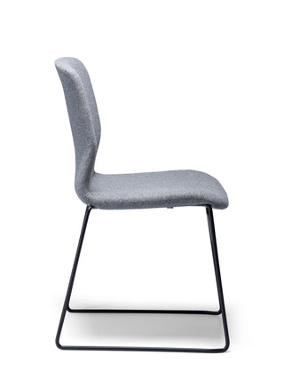Odin Sled fabric side chair with black metal legs on a white background