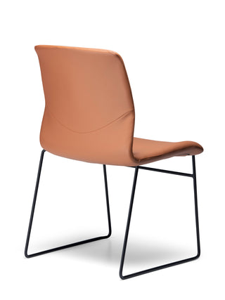 Back angle Odin Sled saddle with black metal legs on a white background