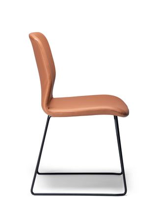 Side Odin Sled saddle with black metal legs on a white background