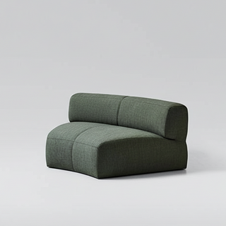 Green modular sofa on a light gray background
