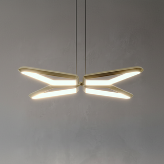 Modern pendant light with gold finish on a plain background