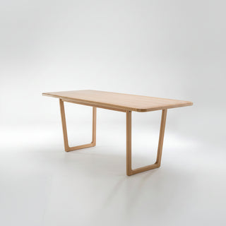 Wooden table with a minimalist design on a white background