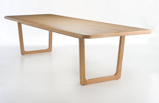 Wooden table with a minimalist design on a white background
