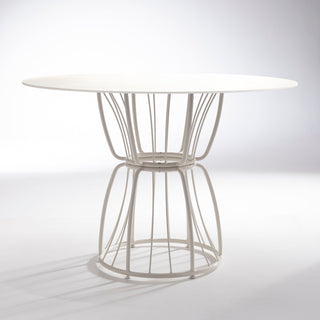 ND dining table with wireframe base on a reflective surface
