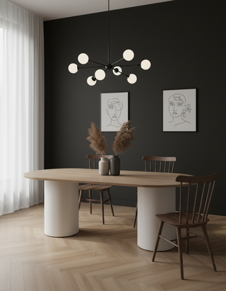 Modern dining room with a black wall, wooden table, and chairs.