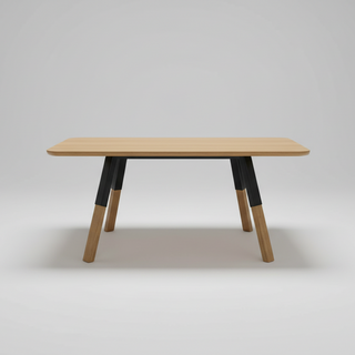Wooden table with black accents on a gray background