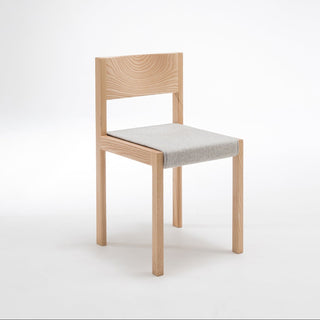 Wooden chair with a gray cushion on a white background