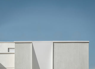 Modern building with a minimal design against a clear blue sky