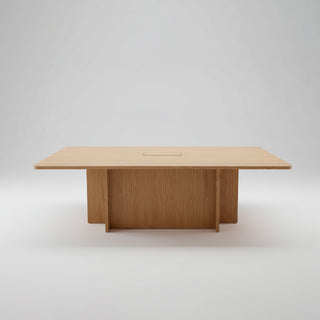 Timber table with integrated power on a light background