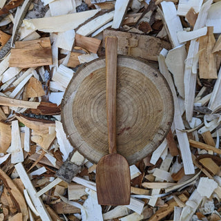 Serving spoon on wood slice
